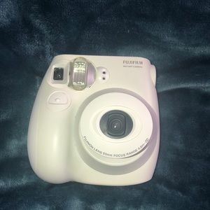 White fujifilm mini Polaroid camera